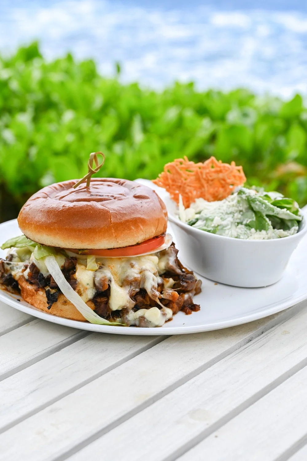 Kai burger with crispy onions and a side of slaw