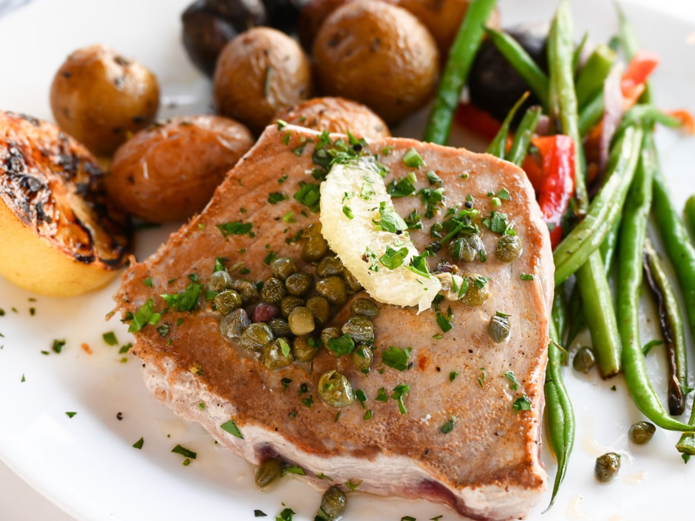 Seared ahi with capers, roasted potatoes and green beans